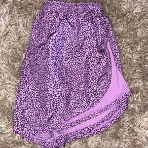 Nike dri fit shorts in purple/black animal print